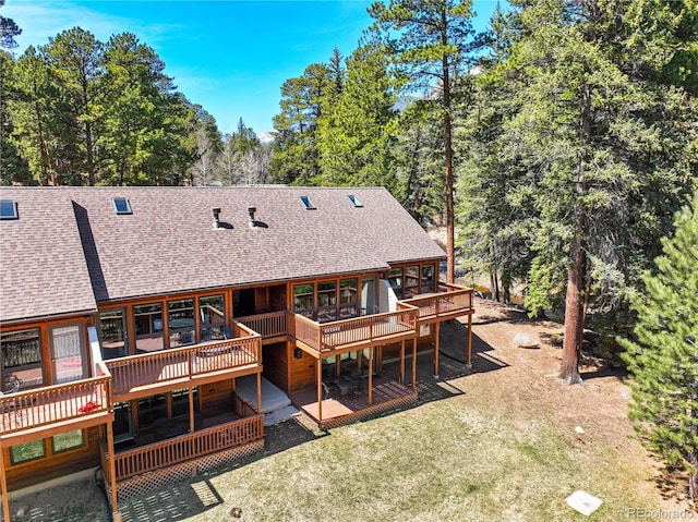 1400 David Dr Unit 1, Estes Park, CO 80517 - rear view of house featuring a wooden deck and roof with shingles