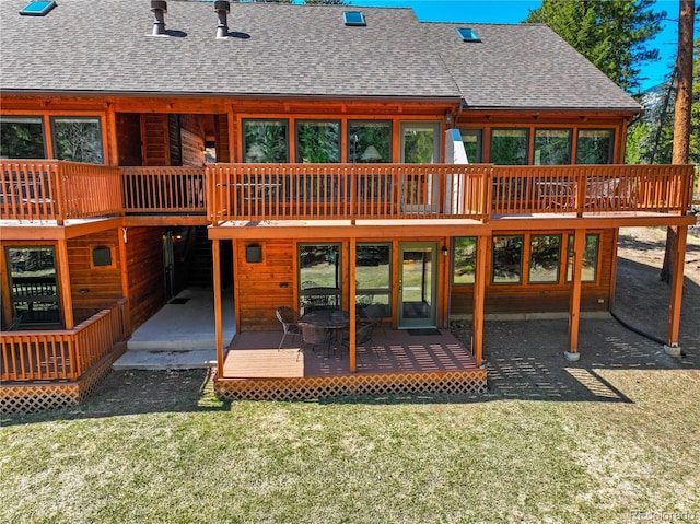 1400 David Dr Unit 1, Estes Park, CO 80517 - back of property with a shingled roof, a yard, and a deck