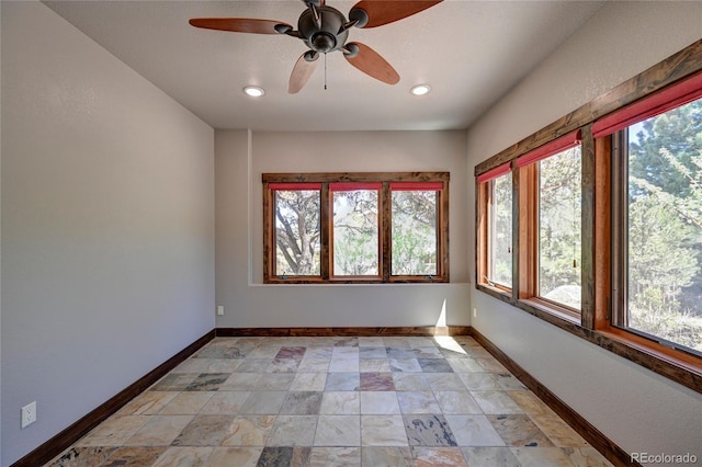 tiled empty room with ceiling fan