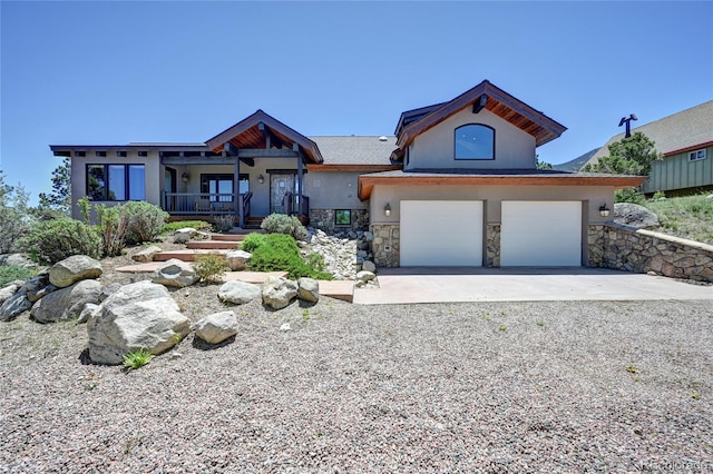 view of front of property with a garage and covered porch