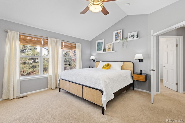 bedroom featuring light carpet, visible vents, baseboards, and lofted ceiling