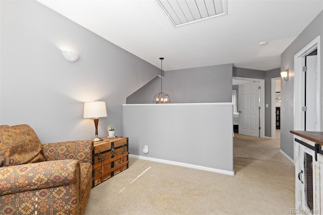 sitting room featuring baseboards, a notable chandelier, visible vents, and carpet flooring