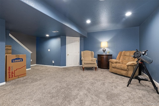 living area with carpet, visible vents, baseboards, and recessed lighting