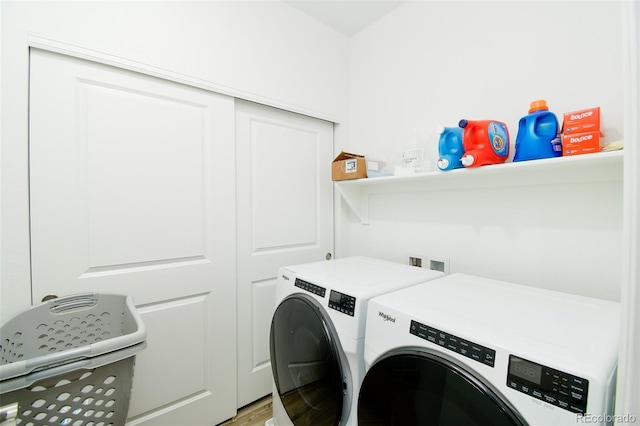 8376 Lorenzo Ln Unit A, Highlands Ranch, CO 80129 - laundry room with independent washer and dryer and light wood-type flooring