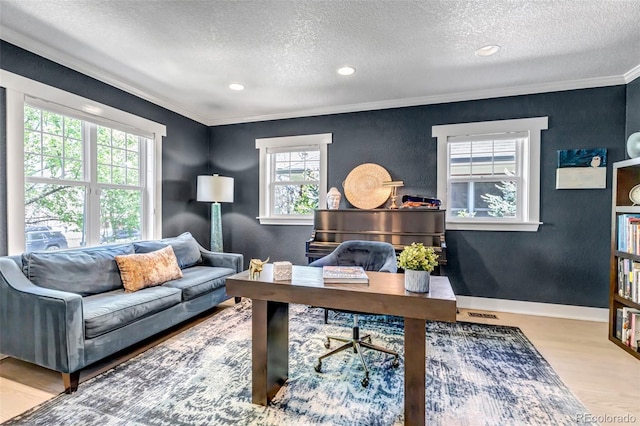 office area with recessed lighting, ornamental molding, a textured ceiling, and wood finished floors