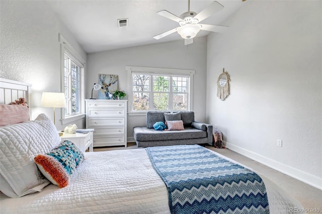 bedroom with baseboards, a textured wall, visible vents, and lofted ceiling