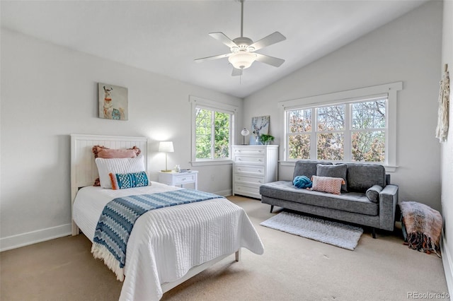 carpeted bedroom with baseboards, ceiling fan, and lofted ceiling