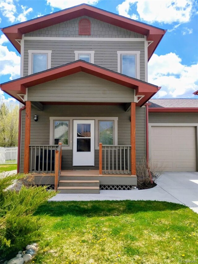 32 Trailside Cir Unit A, Salida, CO 81201 - view of front of house featuring a porch, driveway, and an attached garage