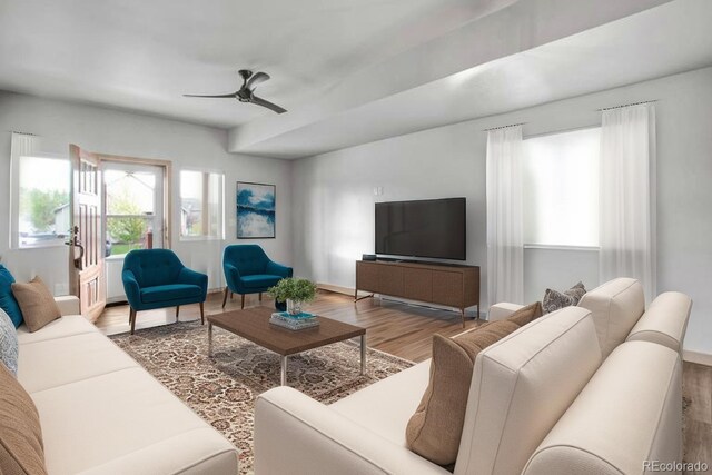 32 Trailside Cir Unit A, Salida, CO 81201 - living area with plenty of natural light, wood finished floors, a ceiling fan, and baseboards