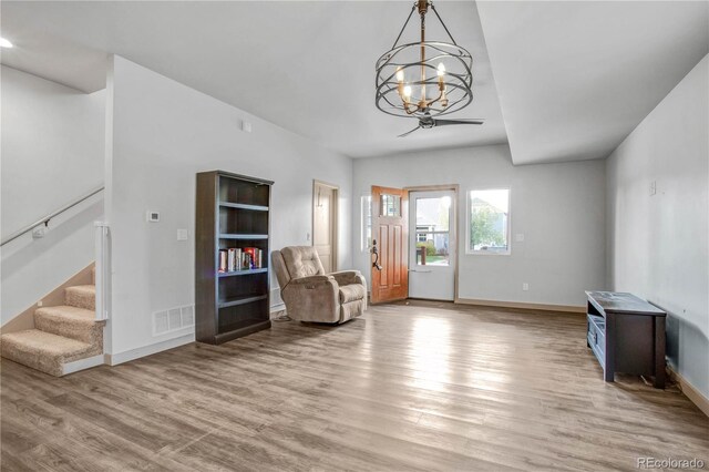 32 Trailside Cir Unit A, Salida, CO 81201 - living area with stairs, a chandelier, light wood-type flooring, and baseboards