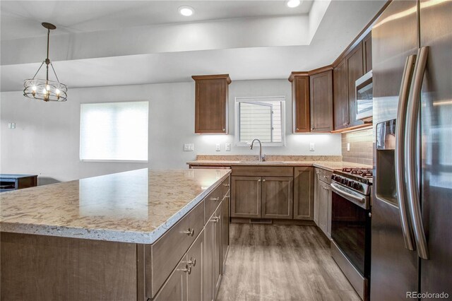 32 Trailside Cir Unit A, Salida, CO 81201 - kitchen with stainless steel appliances, light wood-style flooring, a kitchen island, a sink, and recessed lighting