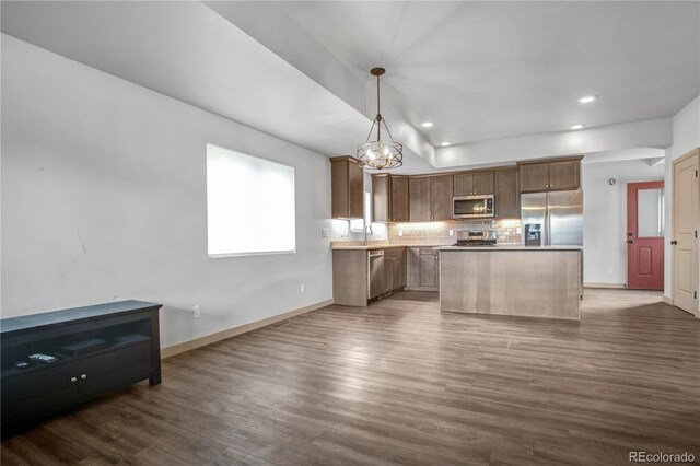 32 Trailside Cir Unit A, Salida, CO 81201 - kitchen featuring stainless steel appliances, dark wood finished floors, backsplash, a chandelier, and baseboards