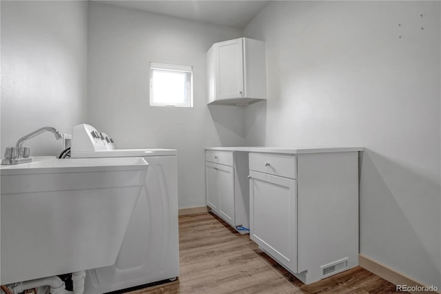 32 Trailside Cir Unit A, Salida, CO 81201 - washroom with washer and dryer, cabinet space, light wood-style flooring, and baseboards