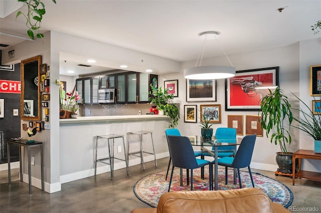 930 Acoma St Unit 106, Denver, CO 80204 - dining space with concrete flooring, baseboards, and recessed lighting