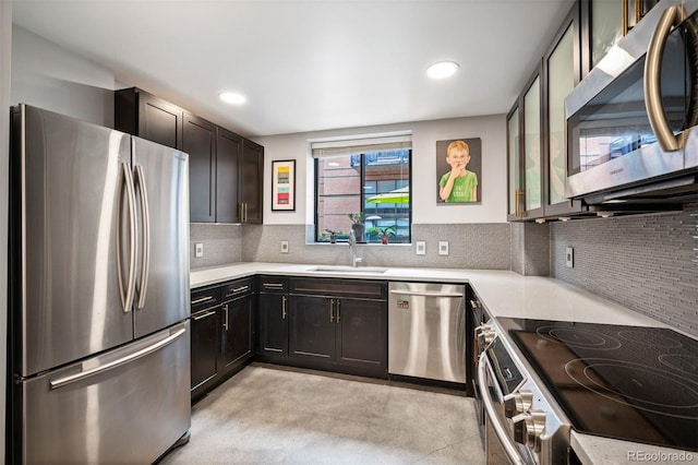 930 Acoma St Unit 106, Denver, CO 80204 - kitchen with stainless steel appliances, a sink, light countertops, backsplash, and recessed lighting