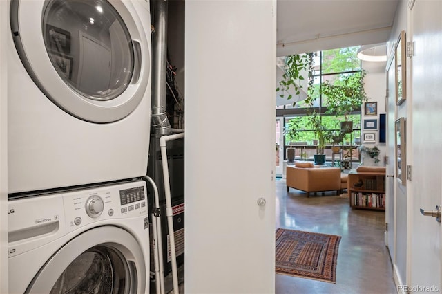 930 Acoma St Unit 106, Denver, CO 80204 - laundry area featuring stacked washing machine and dryer