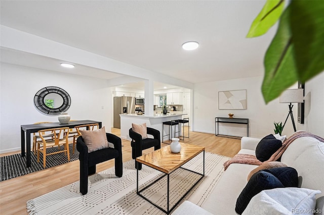 11176 W 62nd Ave, Arvada, CO 80004 - living area featuring light wood finished floors and recessed lighting