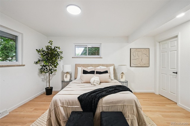 11176 W 62nd Ave, Arvada, CO 80004 - bedroom with multiple windows and wood finished floors