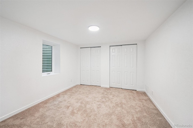 11176 W 62nd Ave, Arvada, CO 80004 - unfurnished bedroom with multiple closets and carpet