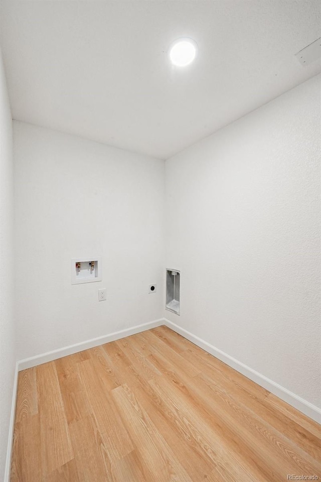 11176 W 62nd Ave, Arvada, CO 80004 - washroom with hookup for a washing machine, electric dryer hookup, and light wood finished floors