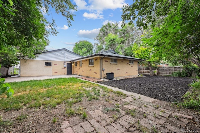 11176 W 62nd Ave, Arvada, CO 80004 - rear view of property featuring brick siding and a patio area