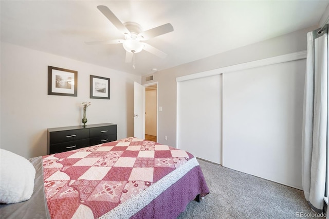 bedroom with carpet floors, a closet, and ceiling fan