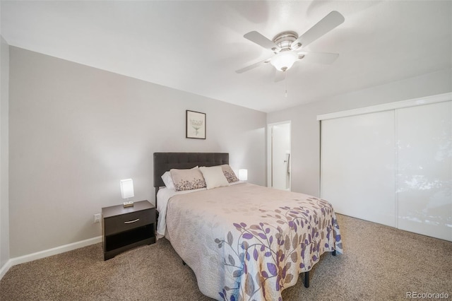 carpeted bedroom with ceiling fan and a closet