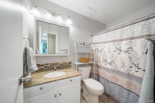 bathroom with vanity, toilet, a shower with shower curtain, and backsplash