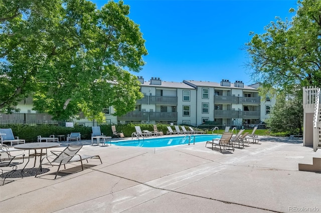 view of swimming pool with a patio area