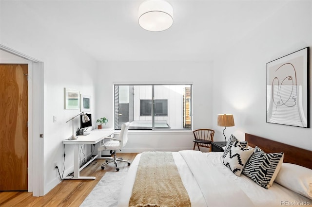 bedroom with light hardwood / wood-style flooring