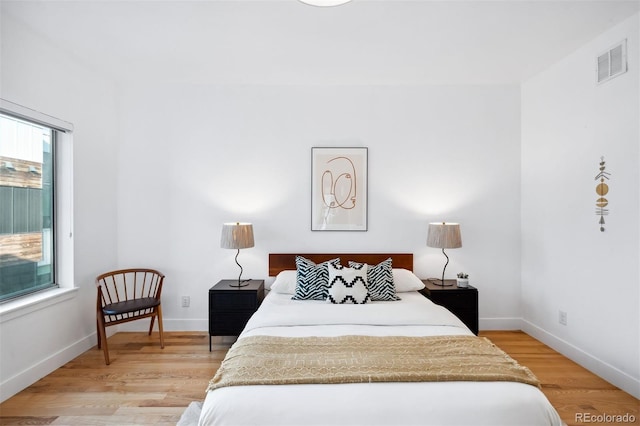 bedroom with light hardwood / wood-style floors