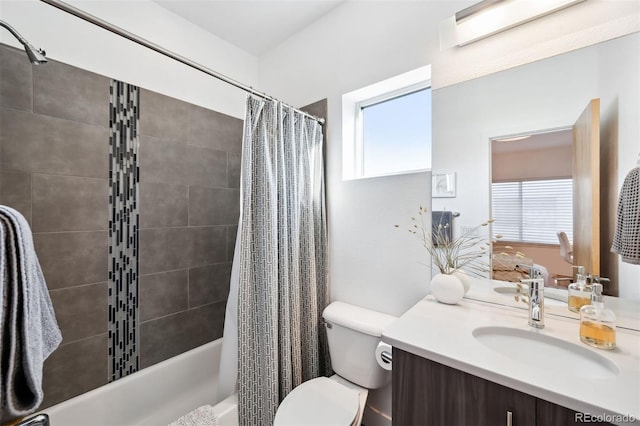 full bathroom with vanity, toilet, and shower / tub combo