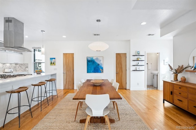 dining area with light wood-type flooring