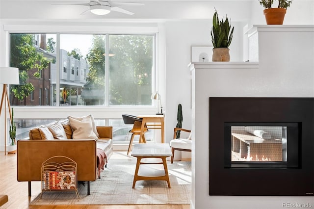 sitting room featuring hardwood / wood-style flooring and ceiling fan