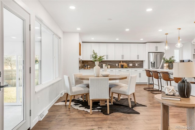 dining area featuring light hardwood / wood-style flooring