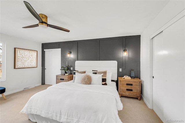 carpeted bedroom featuring ceiling fan