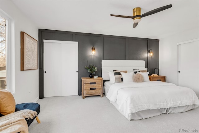 bedroom with light carpet and ceiling fan