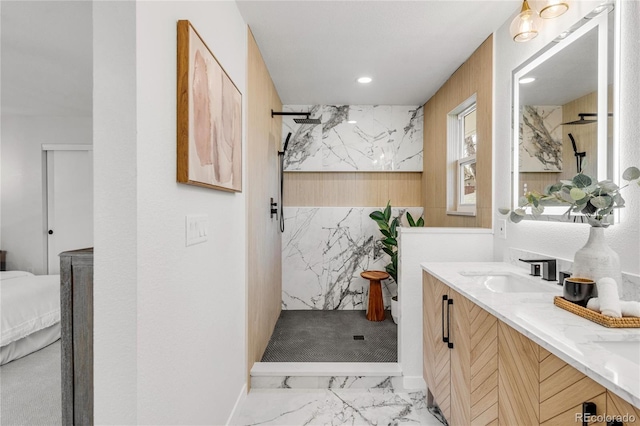 bathroom featuring vanity and a tile shower