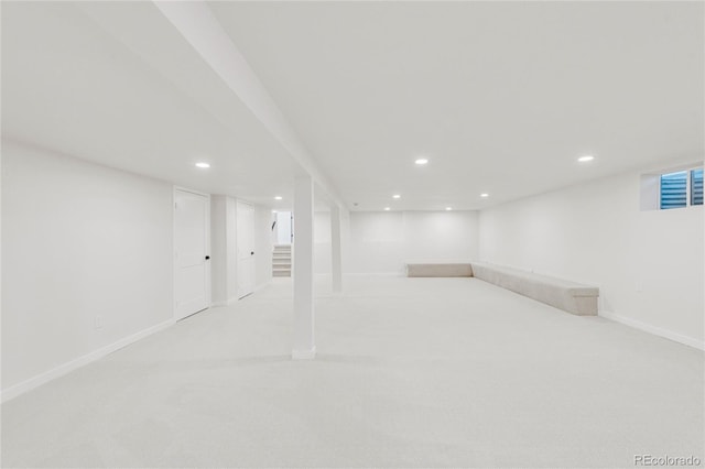 basement with light colored carpet