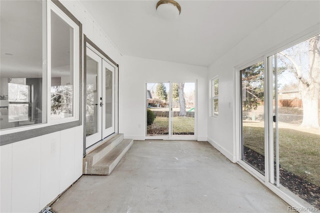 unfurnished sunroom featuring french doors