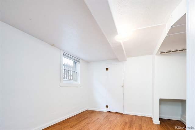 interior space with visible vents, light wood-style flooring, and baseboards