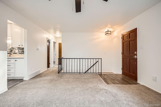 1207 Kingsley Dr, Colorado Springs, CO 80909 - carpeted empty room featuring a ceiling fan and baseboards
