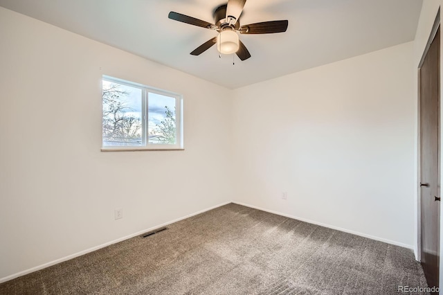 1207 Kingsley Dr, Colorado Springs, CO 80909 - empty room with dark carpet, baseboards, and ceiling fan