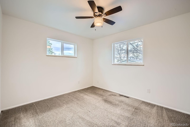 1207 Kingsley Dr, Colorado Springs, CO 80909 - empty room with plenty of natural light, carpet floors, and baseboards