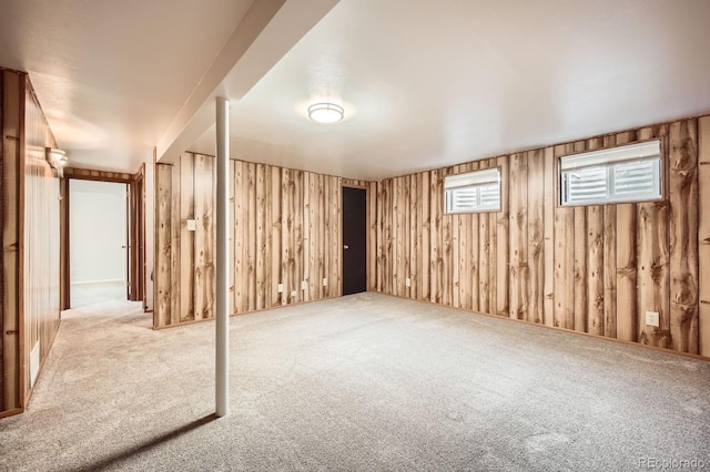 1207 Kingsley Dr, Colorado Springs, CO 80909 - basement featuring carpet and wooden walls