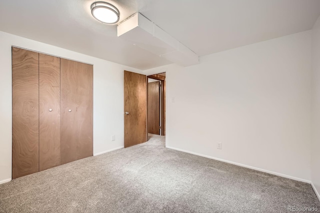 1207 Kingsley Dr, Colorado Springs, CO 80909 - unfurnished bedroom featuring carpet, a closet, and baseboards
