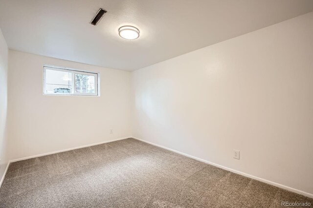 1207 Kingsley Dr, Colorado Springs, CO 80909 - carpeted empty room with baseboards