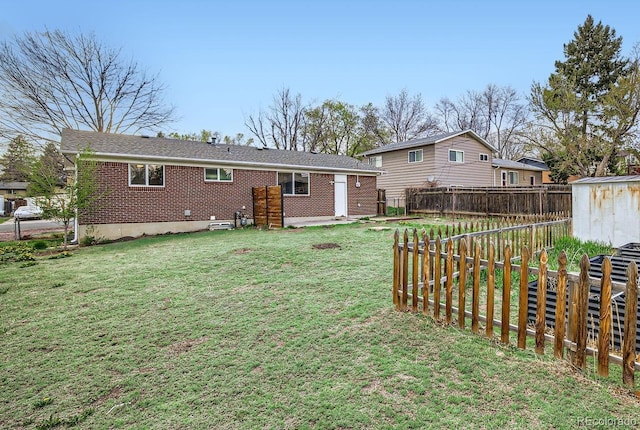 1207 Kingsley Dr, Colorado Springs, CO 80909 - rear view of house featuring brick siding