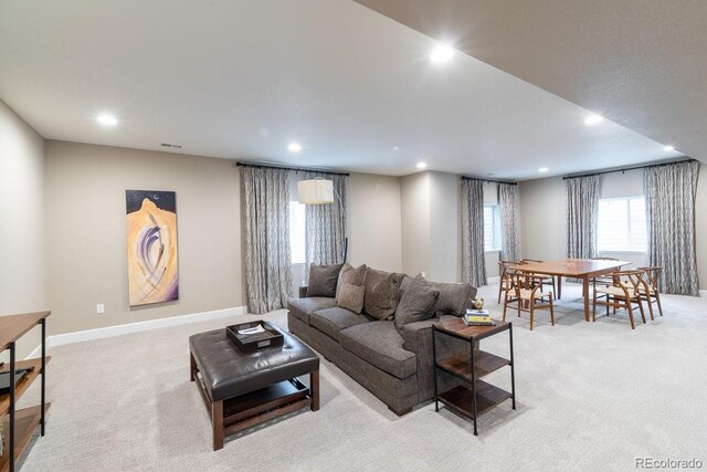 565 Pikes View Dr, Erie, CO 80516 - living room featuring recessed lighting, light colored carpet, and baseboards
