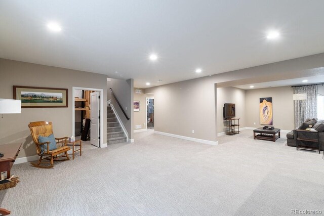 565 Pikes View Dr, Erie, CO 80516 - living area featuring recessed lighting, light colored carpet, stairway, and baseboards